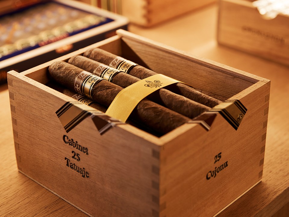 Cigars stored in a wooden cabinet, carefully preserving their quality and aesthetic appeal.