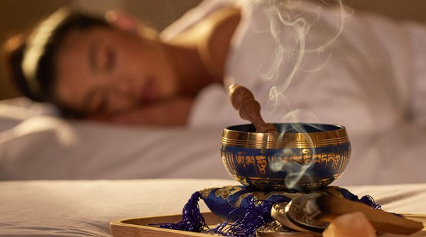 Spa Aromatherapy. A calming aromatherapy scent burns on the preparation table beside the guest