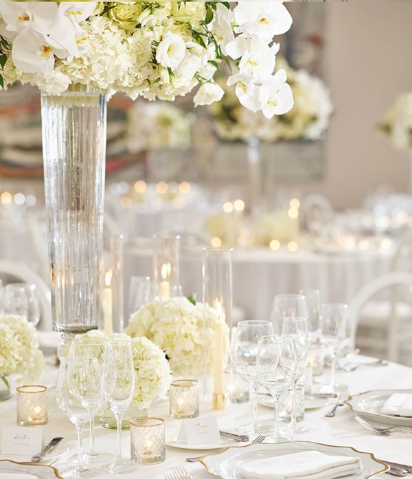 Wedding Event. A table set up for a wedding with a beautiful white floral centrepiece