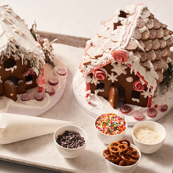Two gingerbread houses with colourful candy decorations