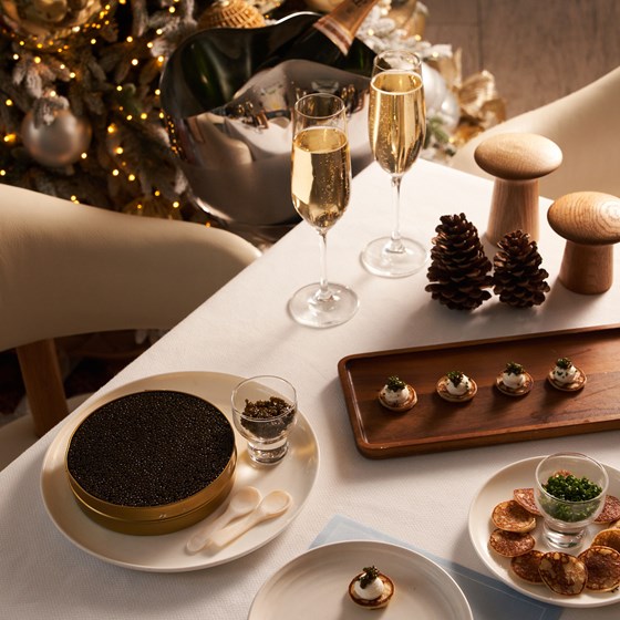 Caviar setup with two glasses of champagne