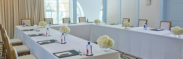 Beverly event space at The Maybourne Beverly Hills set up as a business meeting