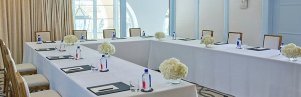 Beverly event space at The Maybourne Beverly Hills set up as a business meeting