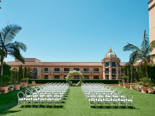 Chairs set up either side of an aisle in the Garden ready for a wedding