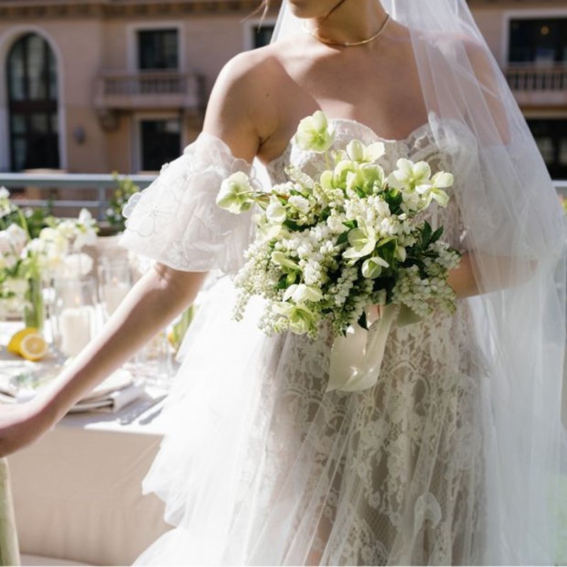 a bride holding a wedding bouquet