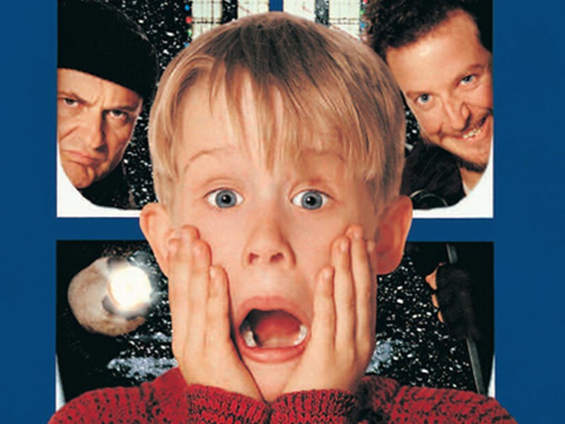 Film poster of Home Alone with child looking shocked