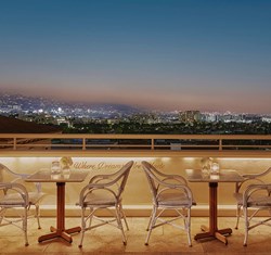 Rooftop dining with a view of the night skyline