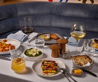 A dinner at The Terrace restaurant showing a main course, salad, and wine