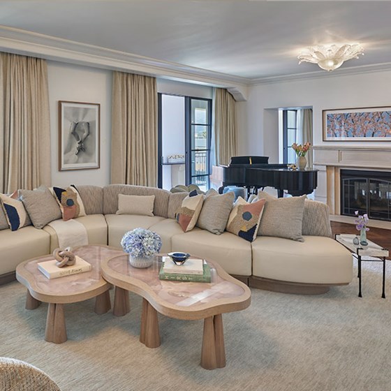 Presidential Suite at The Maybourne Beverly Hills - Living room with sofa, coffee table and piano at the back