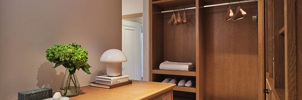 Wooden interiors of a walk-in wardrobe in the Three-Bedroom Residence