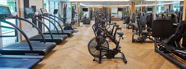 Indoor fitness center with cardio and strength training equipment