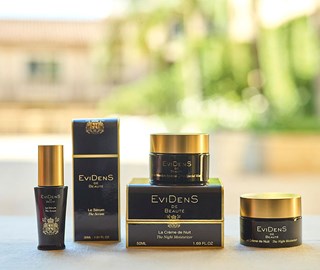 Evidens makeup elegantly displayed, highlighting diversity and timeless elegance on the table.